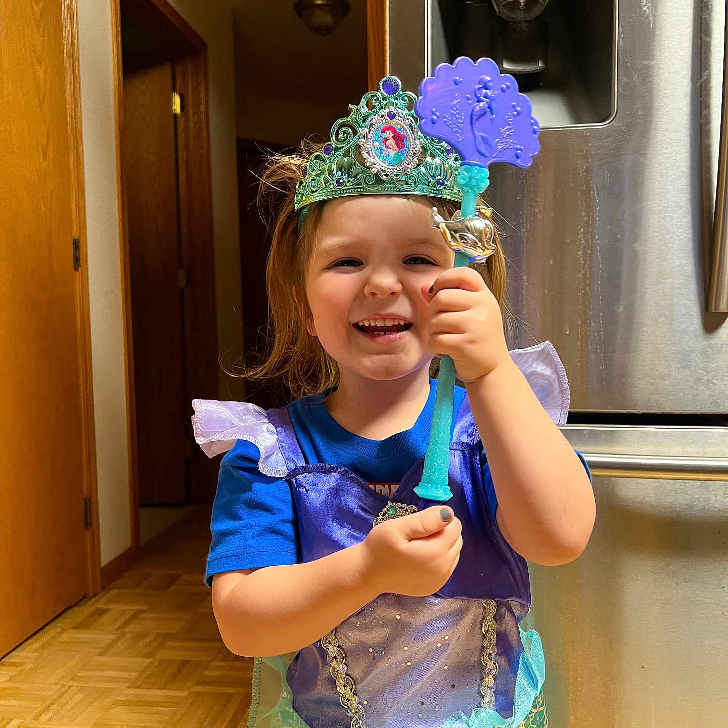 Evelynn is registered to the contest to win money with this photo: accessories, bodypart, child, clothing, dress, face, female, finger, girl, hand, hardwood, hat, head, jewelry, person, photography, portrait, purple, tiara, wood