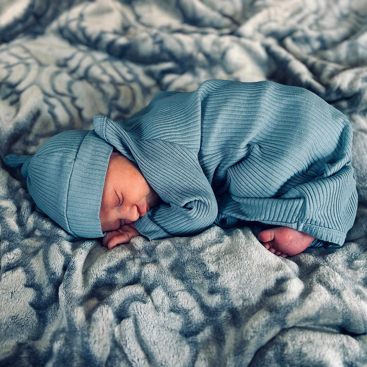 Waylon is registered to the contest to win money with this photo: baby, blanket, bonnet, clothing, face, hat, head, newborn, person, photography, portrait, quilt, sleeping