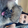Karrueche is registered to the contest to win money with this photo: dog, puppy, fluffy, tongue, pet, animal, woman, person, car, seat, interior, selfie, cute, happy, portrait, face, fur, playful, companion, friendship