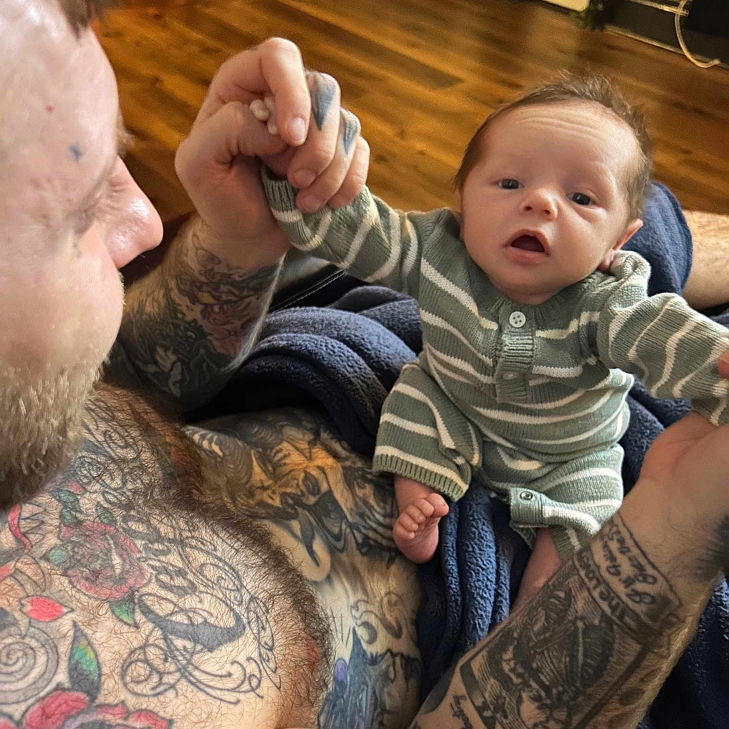 Loki is registered to the contest to win money with this photo: architecture, arm, baby, bodypart, building, couch, face, finger, furniture, hand, head, indoors, interiordesign, newborn, person, photography, portrait, skin, tattoo, wrist