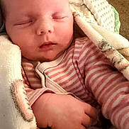 Hope joined the competition — help win amazing prizes! baby, sleeping, blanket, pink_stripes, cozy, infant, hand, soft, face, peaceful, cute, child, warm, resting, portrait, indoors, newborn, wrapped, comfort, relaxing