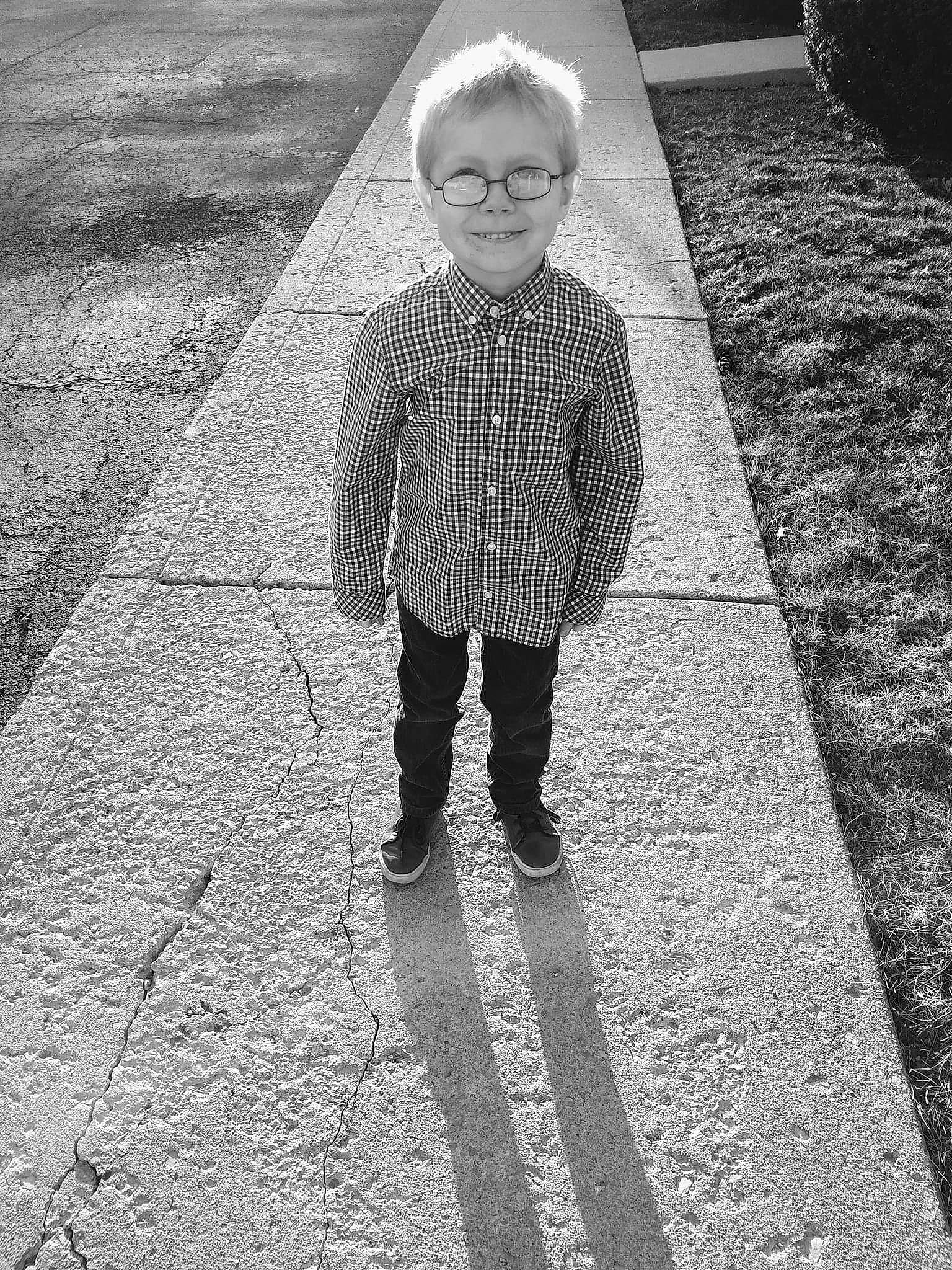 Aidan joined the competition — help win amazing prizes! asphalt, black, black_and_white, child, cobblestone, joy, monochrome, monochrome_photography, outerwear, pattern, people, person, photograph, photography, road_surface, sidewalk, smile, snapshot, standing, stock_photography