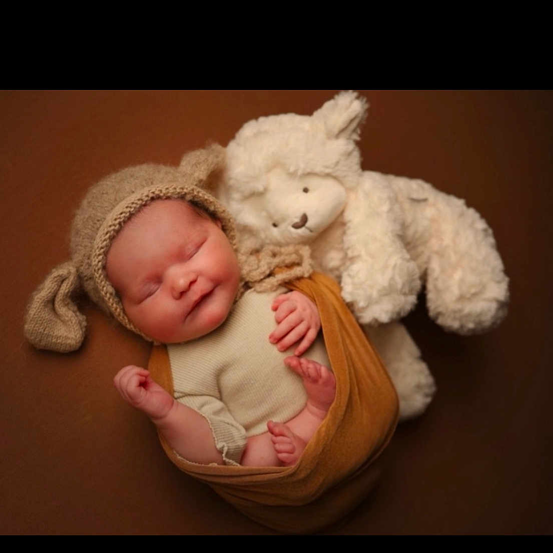 Darcie-Rose joined the competition — help win amazing prizes! adorable, baby, brown_background, child, cozy, cuddly, cute, floppy_ears, indoors, infant, knitted_hat, newborn, peaceful, portrait, resting, sleeping, soft_toy, teddy_bear, warm_colors, wrapped