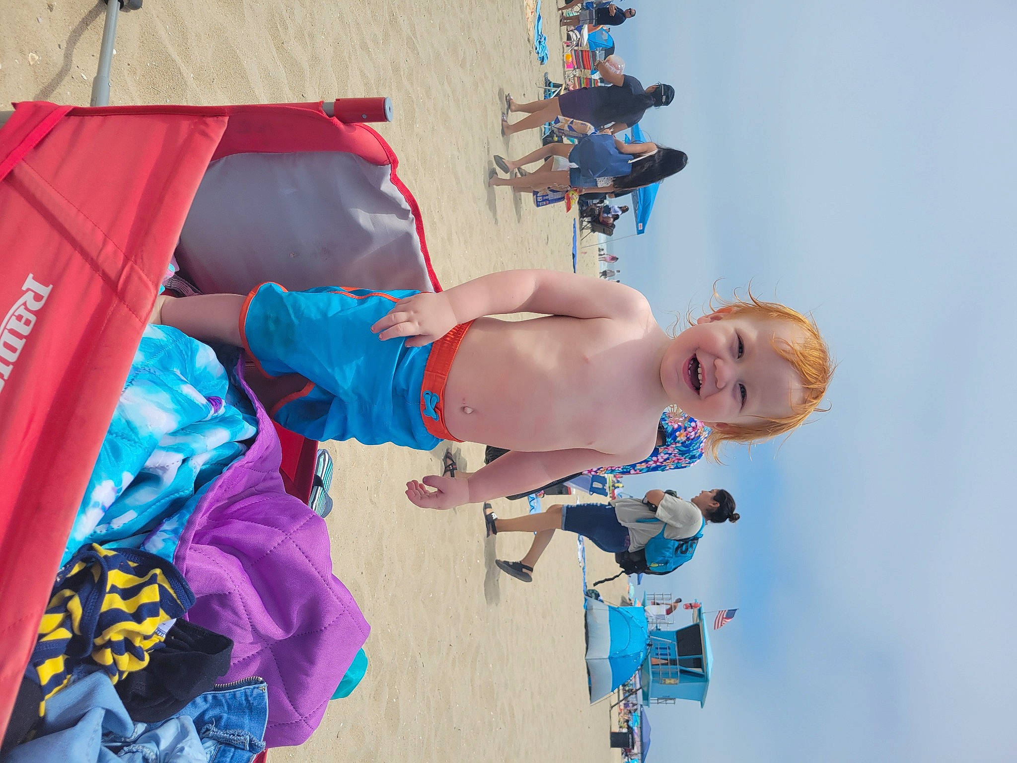 Cade is registered to the contest to win money with this photo: blue, child, elbow, electric_blue, event, fun, happy, hat, joy, leisure, magenta, person, recreation, shorts, sky, t_shirt, tent, toddler, vacation