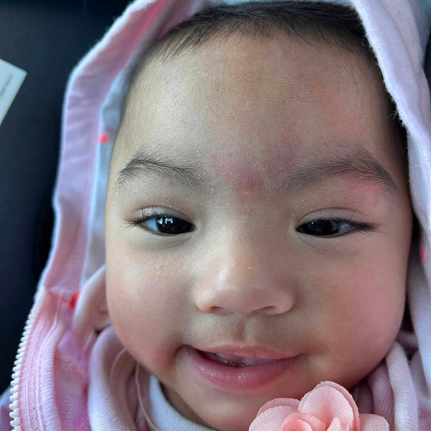 Isla is registered to the contest to win money with this photo: baby, babylaughing, bonnet, clothing, dimples, face, flower, happy, hat, head, hood, hoodie, knitwear, person, photography, plant, portrait, rose, skin, smile