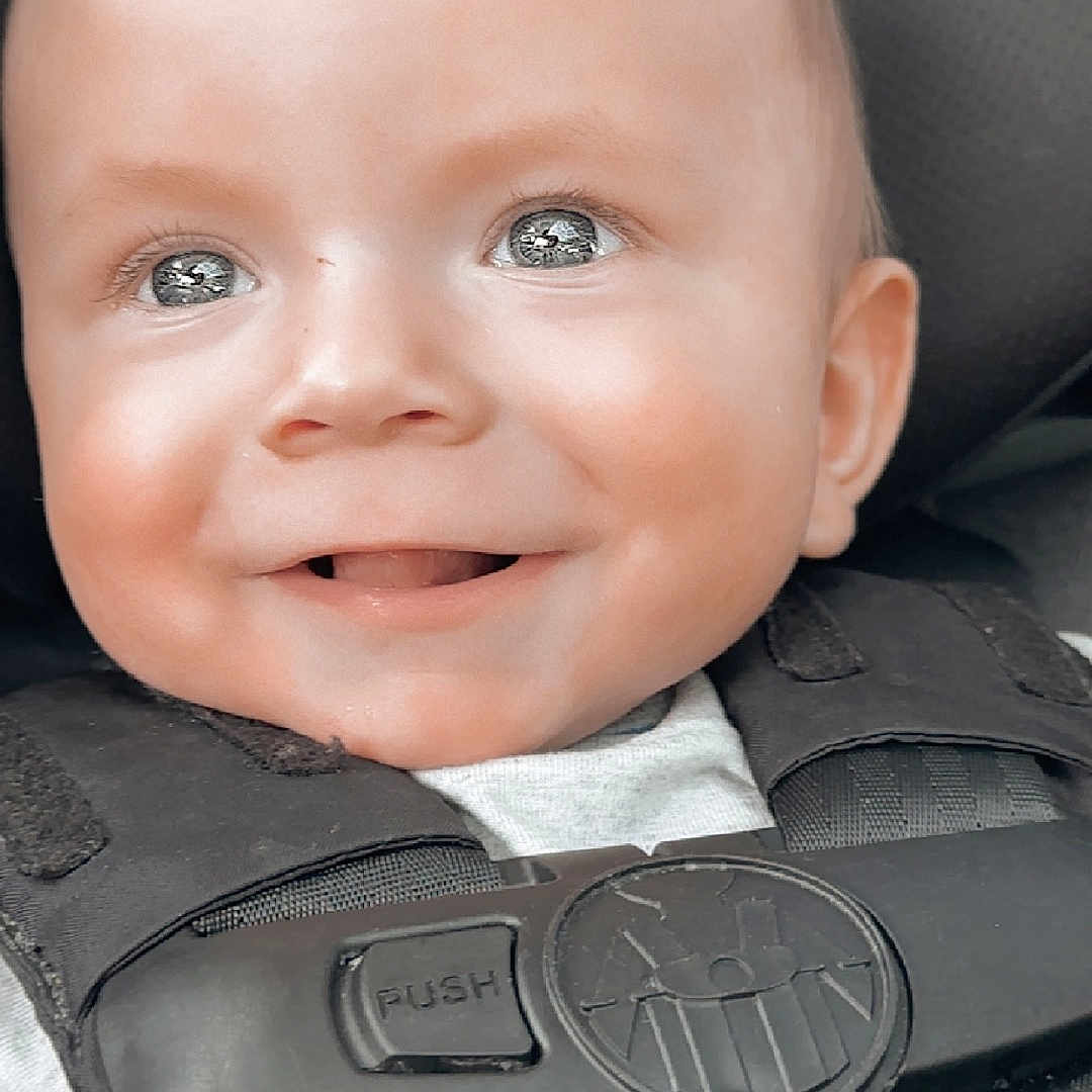 Karter joined the competition — help win amazing prizes! accessories, baby, babylaughing, belt, clothing, cushion, face, formalwear, happy, head, homedecor, lifejacket, person, photography, portrait, seatbelt, smile, strap, tie, vest