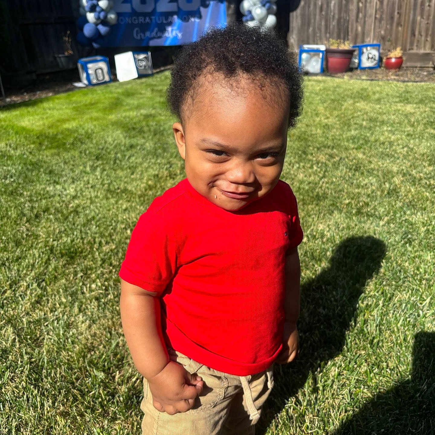 Asyias is registered to the contest to win money with this photo: backyard, ball, boy, child, clothing, face, grass, head, lawn, male, nature, outdoors, pants, park, person, photography, plant, portrait, t_shirt, yard