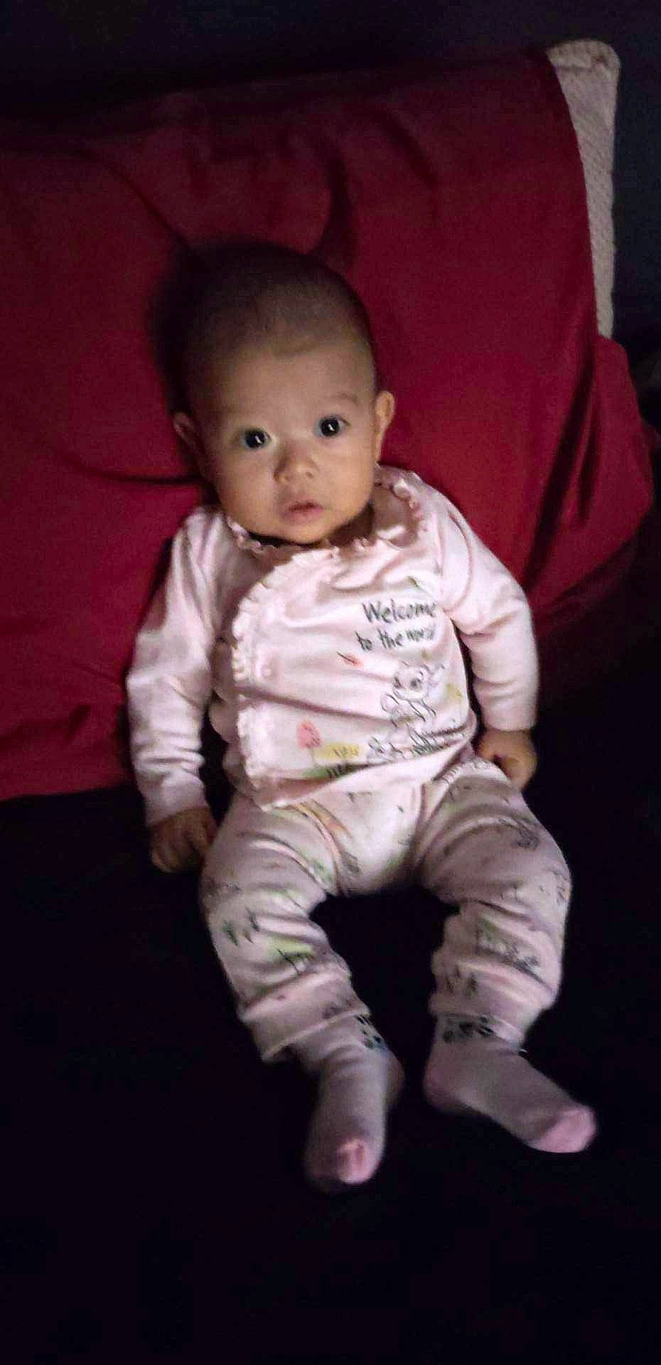 Emily joined the competition — help win amazing prizes! baby, baby_toddler_clothing, beauty, carmine, cheek, comfort, darkness, flash_photography, flooring, human_body, iris, linens, lip, nose, person, pink, sitting, sleeve, smile, t_shirt