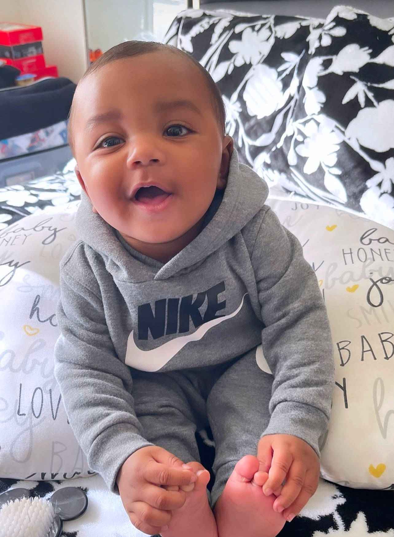 Amiri is registered to the contest to win money with this photo: baby, baby_toddler_clothing, beauty, cheek, comfort, cool, face, facial_expression, finger, flooring, happy, head, mouth, person, product, skin, sleeve, smile, t_shirt, toddler