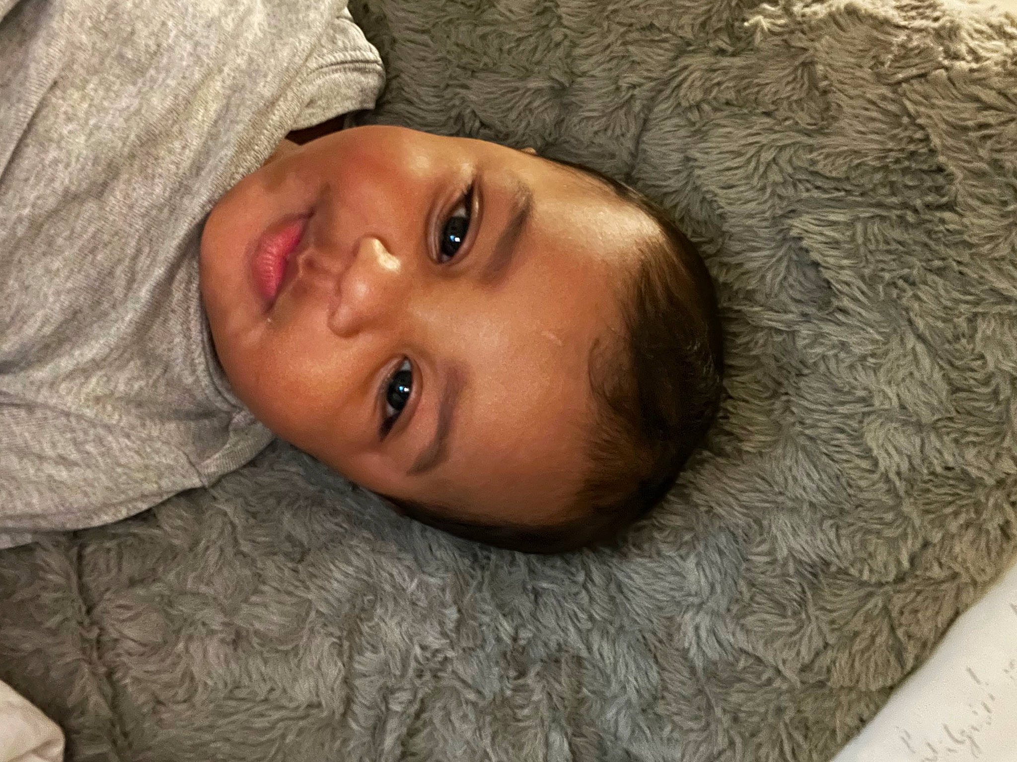 Amiri is registered to the contest to win money with this photo: cheek, child, comfort, eye, eyebrow, eyelash, forehead, fur, grass, happy, head, iris, lip, mouth, nose, person, plant, skin, smile, toddler