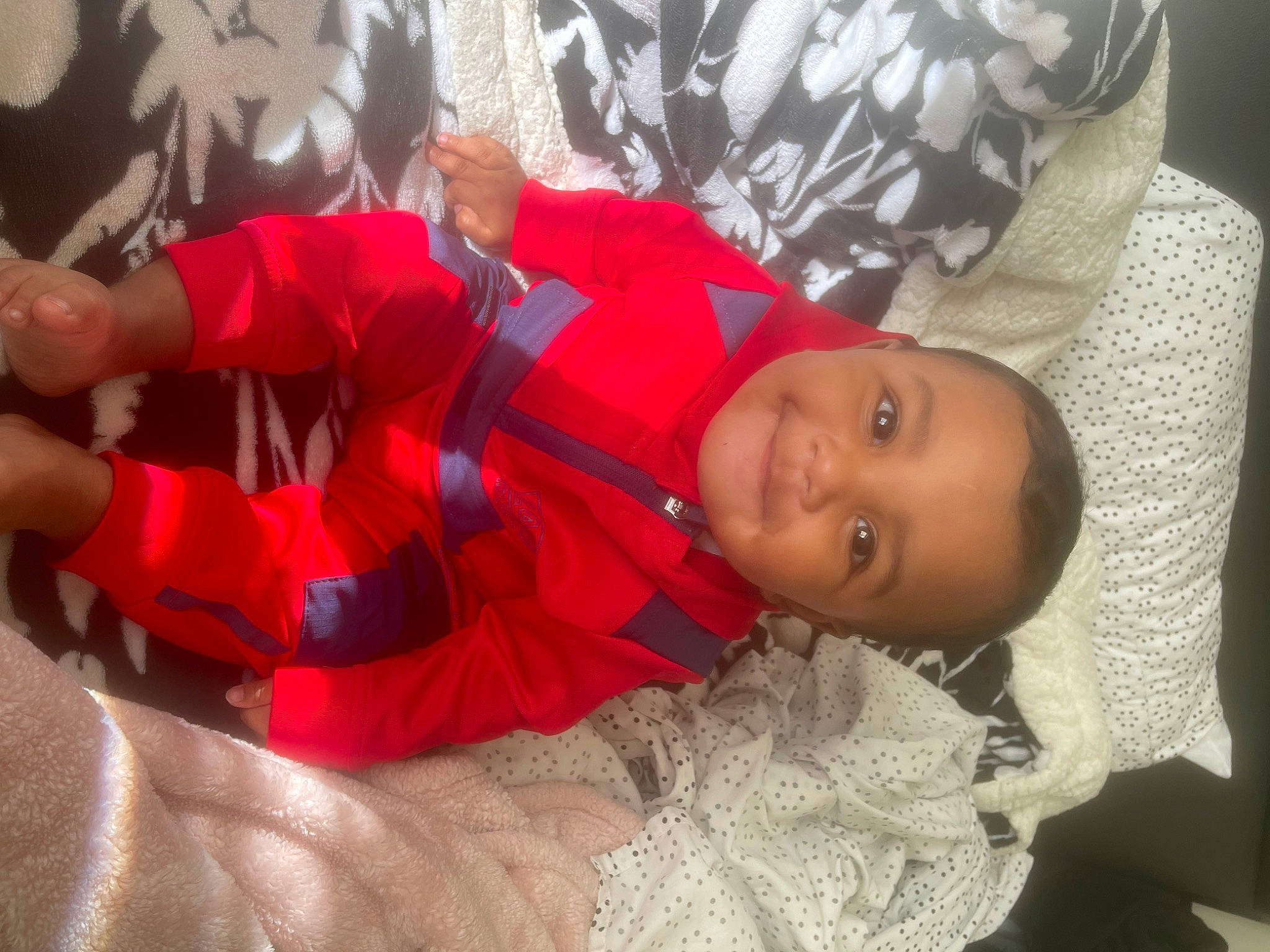 Amiri joined the competition — help win amazing prizes! baby, baby_toddler_clothing, carmine, child, comfort, elbow, event, fun, happy, joy, linens, nap, pattern, person, room, sleep, sleeve, smile, toddler