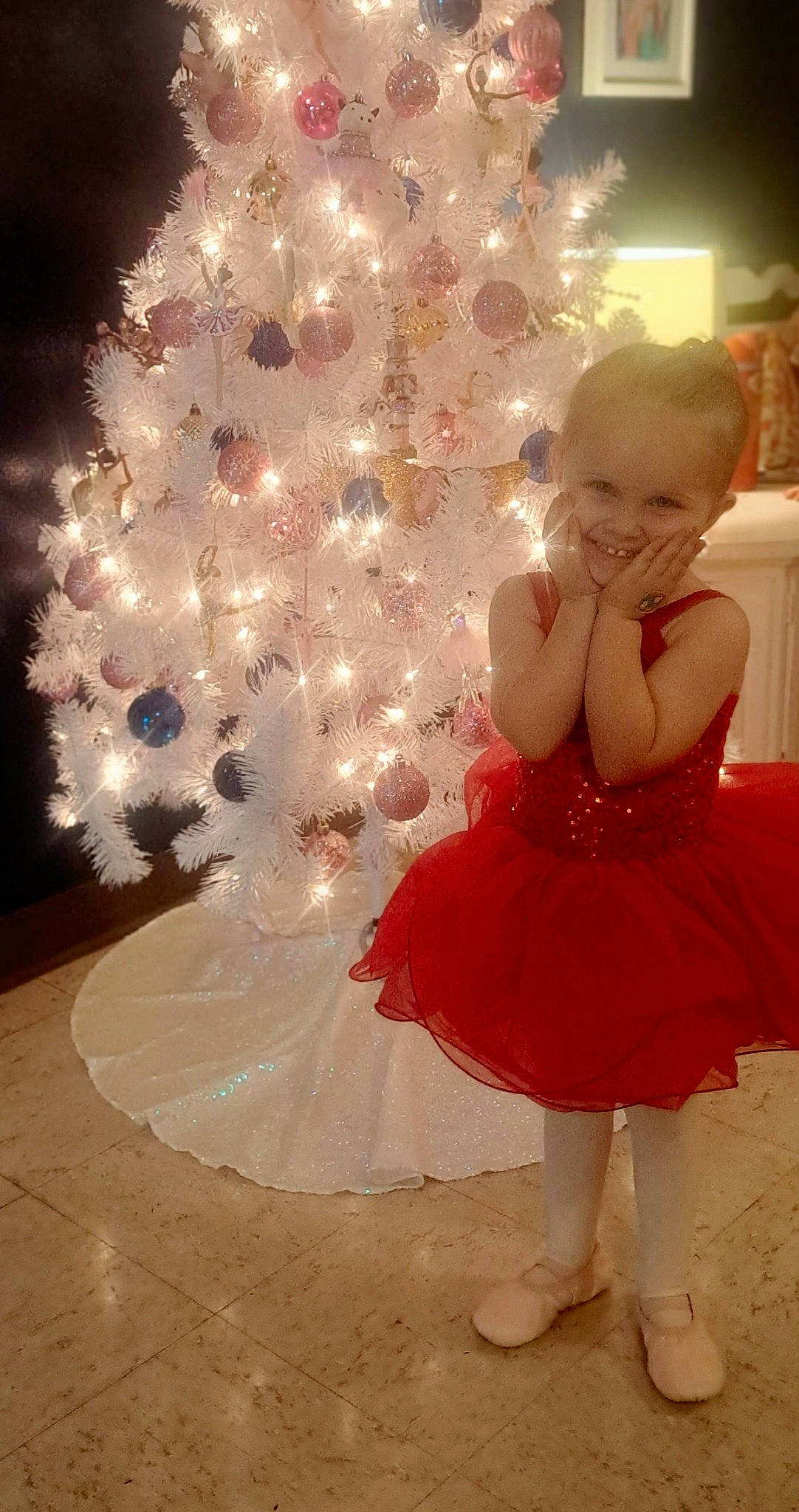 Lily joined the competition — help win amazing prizes! baby_toddler_clothing, christmas_decoration, christmas_ornament, christmas_tree, day_dress, dress, event, flooring, formal_wear, fun, happy, head, holiday, holiday_ornament, human_body, joy, ornament, person, pink, plant