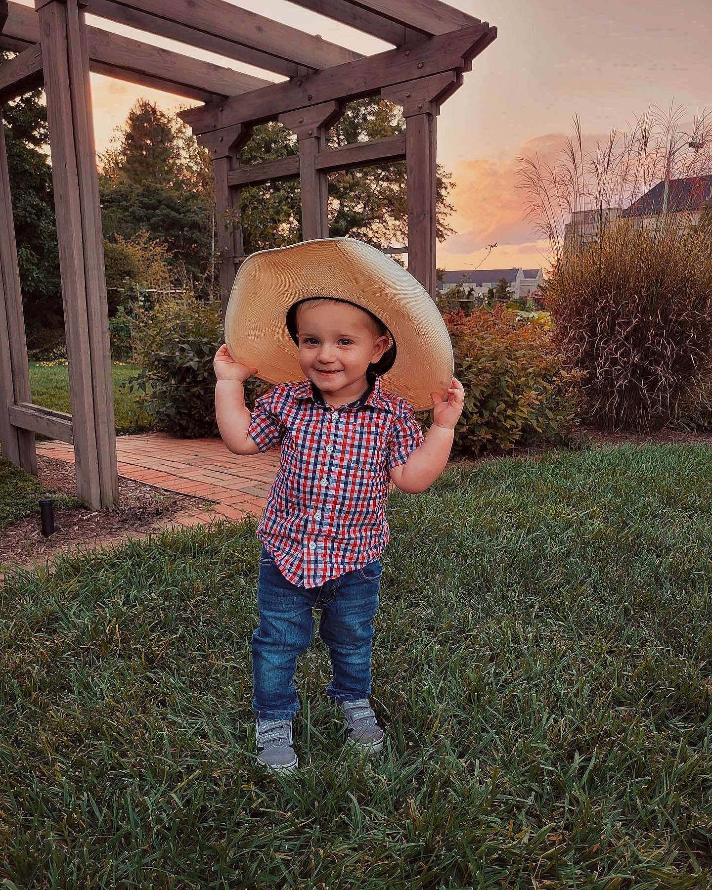 Brantley joined the competition — help win amazing prizes! baby_toddler_clothing, denim, flash_photography, grass, grassland, happy, hat, joy, landscape, leaf, leisure, pattern, people_in_nature, person, plant, sky, smile, sun_hat, t_shirt, tints_and_shades