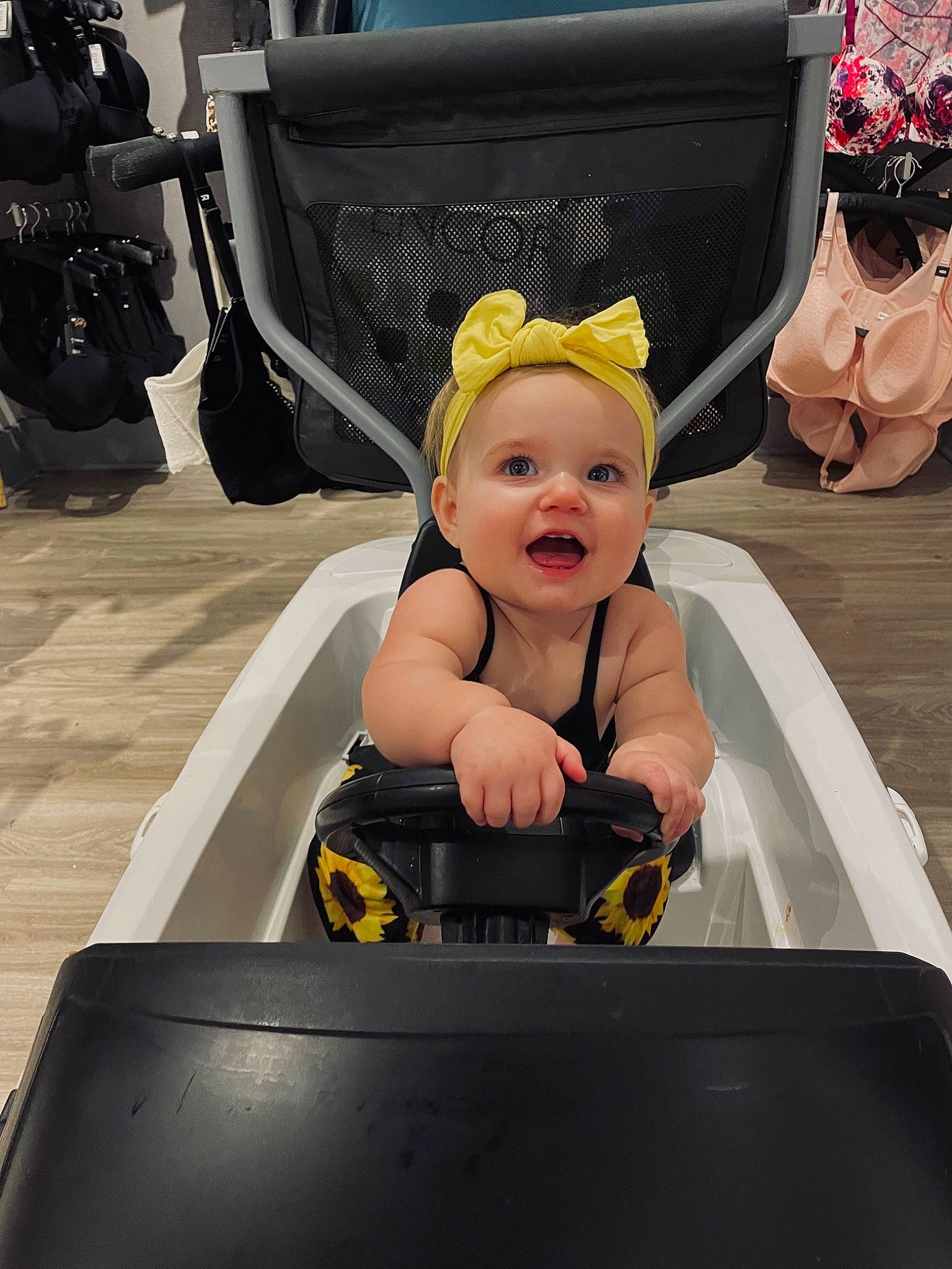 Maisley is registered to the contest to win money with this photo: auto_part, automotive_design, automotive_exterior, automotive_tire, baby, baby_products, baby_toddler_clothing, bag, child, fun, happy, hat, leisure, motor_vehicle, person, personal_protective_equipment, recreation, sitting, smile, toddler