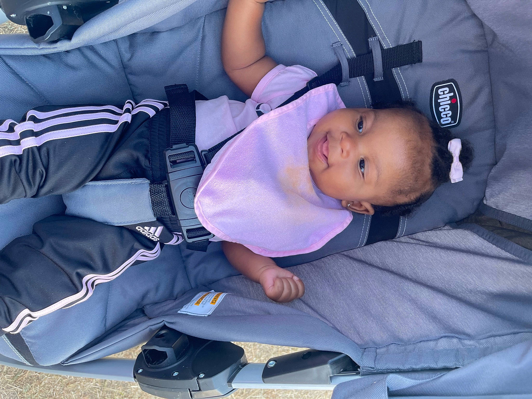 Kai is registered to the contest to win money with this photo: auto_part, baby, baby_carriage, baby_products, baby_toddler_clothing, car_seat, child, comfort, electric_blue, person, sitting, toddler
