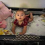 Elliot joined the competition — help win amazing prizes! baby, infant, playpen, onesie, stuffed_animal, blanket, tummy_time, curious, indoor, child, cute, expression, soft_toys, colorful, cushioned, face, head, skin, person, young