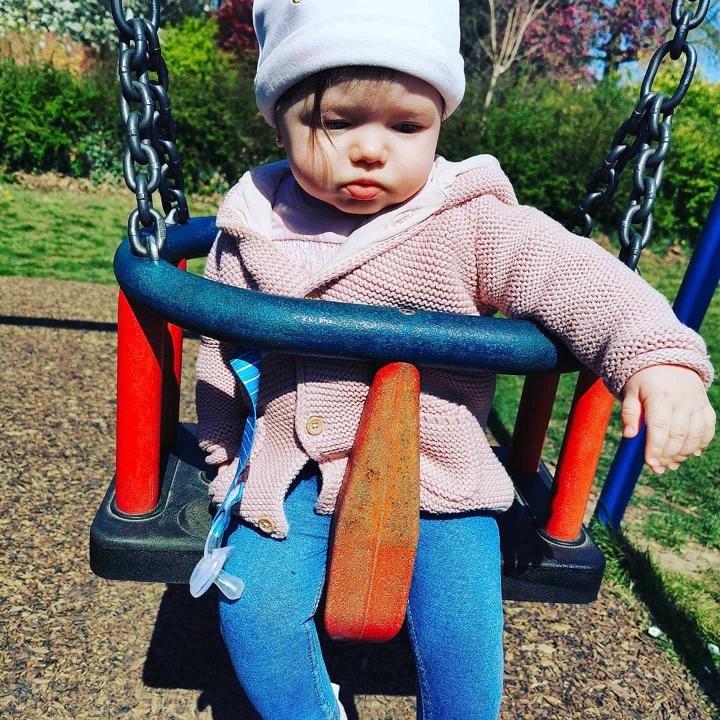 Amalia joined the competition — help win amazing prizes! baby, baby_carriage, baby_toddler_clothing, chair, cool, eye, grass, happy, headwear, human_body, leaf, leg, leisure, people_in_nature, person, plant, recreation, skin, swing, toddler