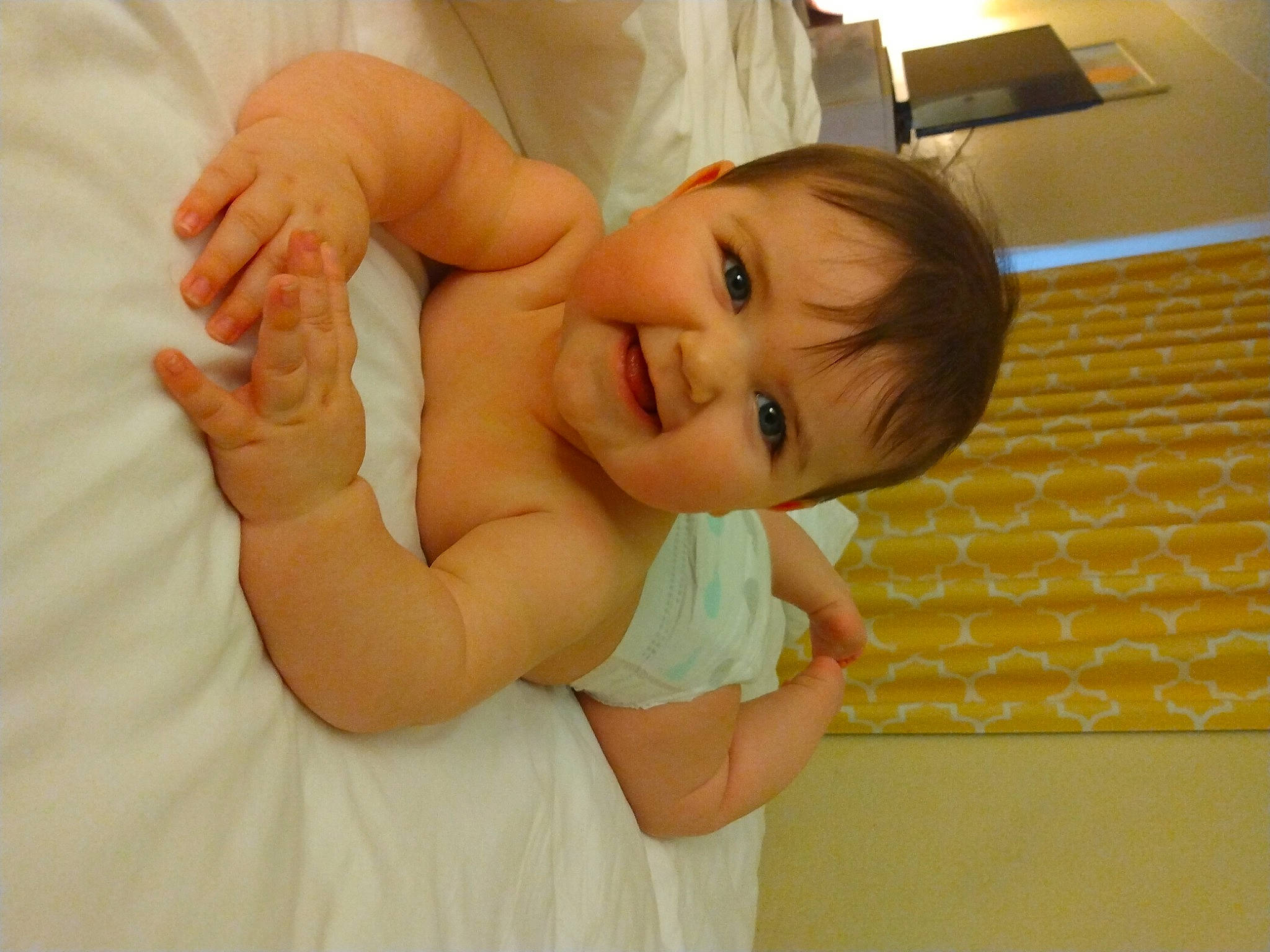 Brya is registered to the contest to win money with this photo: baby, baby_toddler_clothing, child, comfort, dress, elbow, event, finger, gesture, hand, happy, joy, nail, neck, person, shoulder, skin, sleeve, smile, thumb