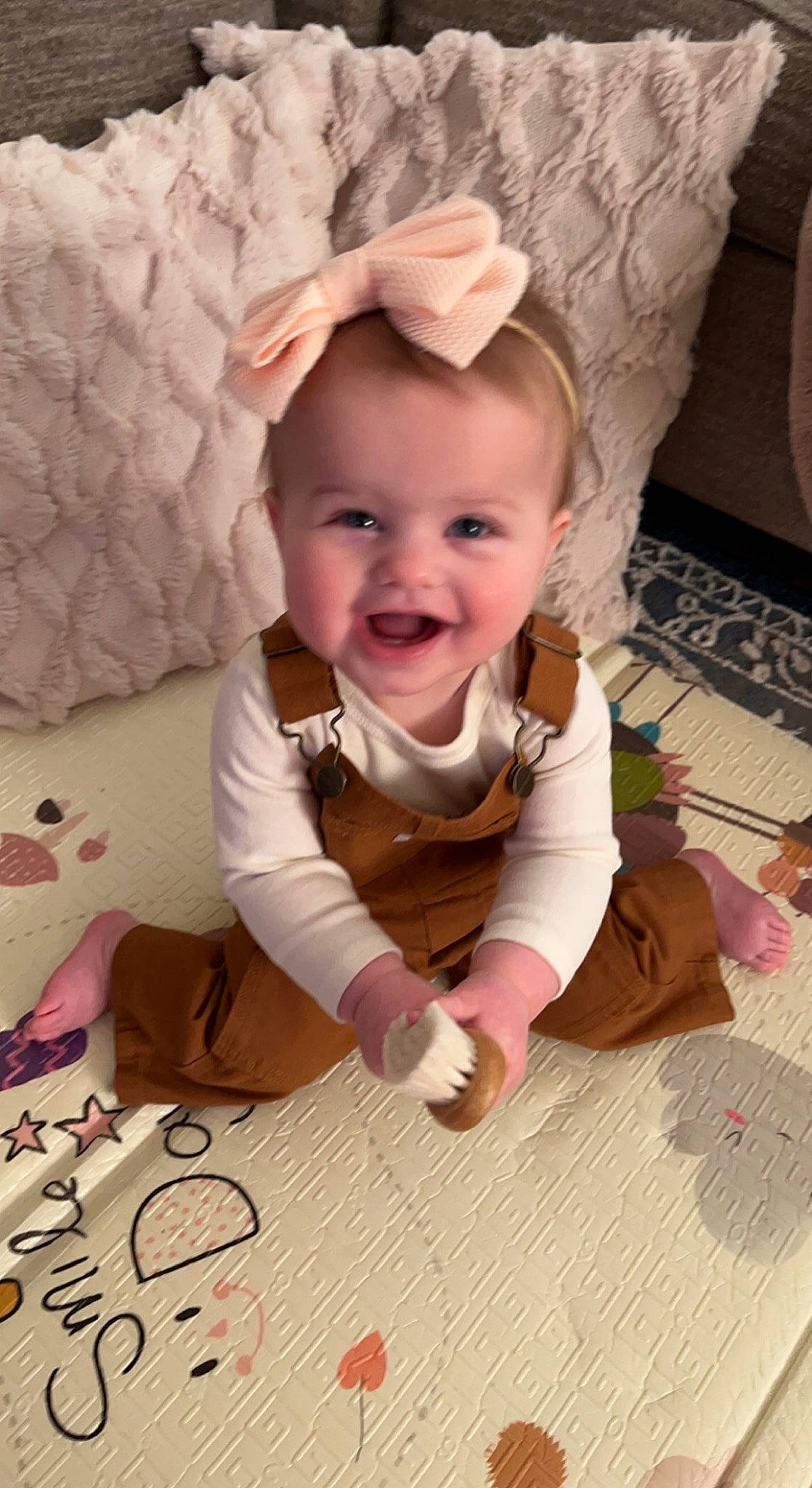 Kinley is registered to the contest to win money with this photo: baby, baby_laughing, baby_toddler_clothing, cheek, child, dress, eye, floor, flooring, fun, happy, joy, pattern, person, pink, room, skin, sleeve, smile, textile