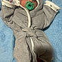 Maxwell is registered to the contest to win money with this photo: baby, infant, pacifier, gray_towel, hooded_towel, blue_blanket, soft_texture, newborn, cute, lying_down, wrapped, face, eyes, hand, foot, comfort, warmth, indoors, child, portrait