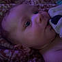 Maxwell joined the competition — help win amazing prizes! baby, infant, face, blanket, plush_toy, pattern, purple_light, closeup, portrait, child, cute, sleeping_area, soft_light, indoor, head, skin, expression, nibble, comfort, warm
