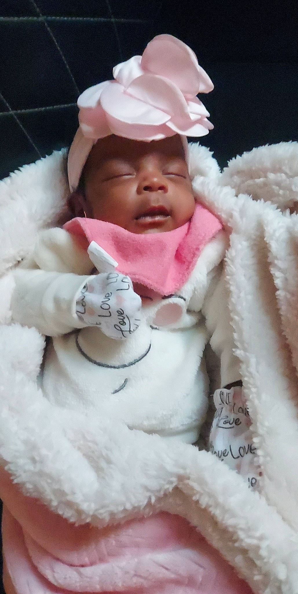 Aubrielle is registered to the contest to win money with this photo: baby, baby_toddler_clothing, cap, cheek, child, comfort, fashion_accessory, fur, fur_clothing, happy, headwear, jacket, linens, lip, magenta, peach, person, pink, skin, sleeve