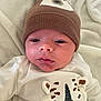 élio a rejoint le concours — aidez-le/la à gagner de superbes lots ! animal_face, apparel, baby, baby_clothes, blanket, child, clothing, cute, expression, face, hat, headwear, indoor, infant, knit_hat, lying_down, newborn, onesie, portrait, soft_texture