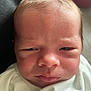 élio a rejoint le concours — aidez-le/la à gagner de superbes lots ! newborn, baby, infant, face, skin, close_up, expression, wrapped, blanket, head, person, young_child, indoors, natural_light, human, portrait, cute, soft, newborn_clothing, baby_hair