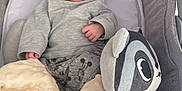 élio participe au concours pour gagner de l'argent avec cette photo : baby, sleeping, infant, plush_toy, blanket, baby_seat, clothing, cute, resting, soft_texture, gray, comfort, child, peaceful, indoors, toy, face, head_support, cozy, newborn