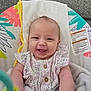 Raelynn is registered to the contest to win money with this photo: baby, smiling, infant, blanket, baby_seat, toy, clothing, happy, face, head, person, indoor, couch, fabric, button, cute, child, comfort, sitting, closeup