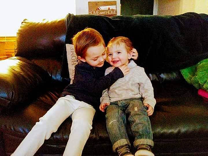 Cole is registered to the contest to win money with this photo: child, daughter, family, fun, girl, interaction, joy, person, product, sibling, sitting, toddler