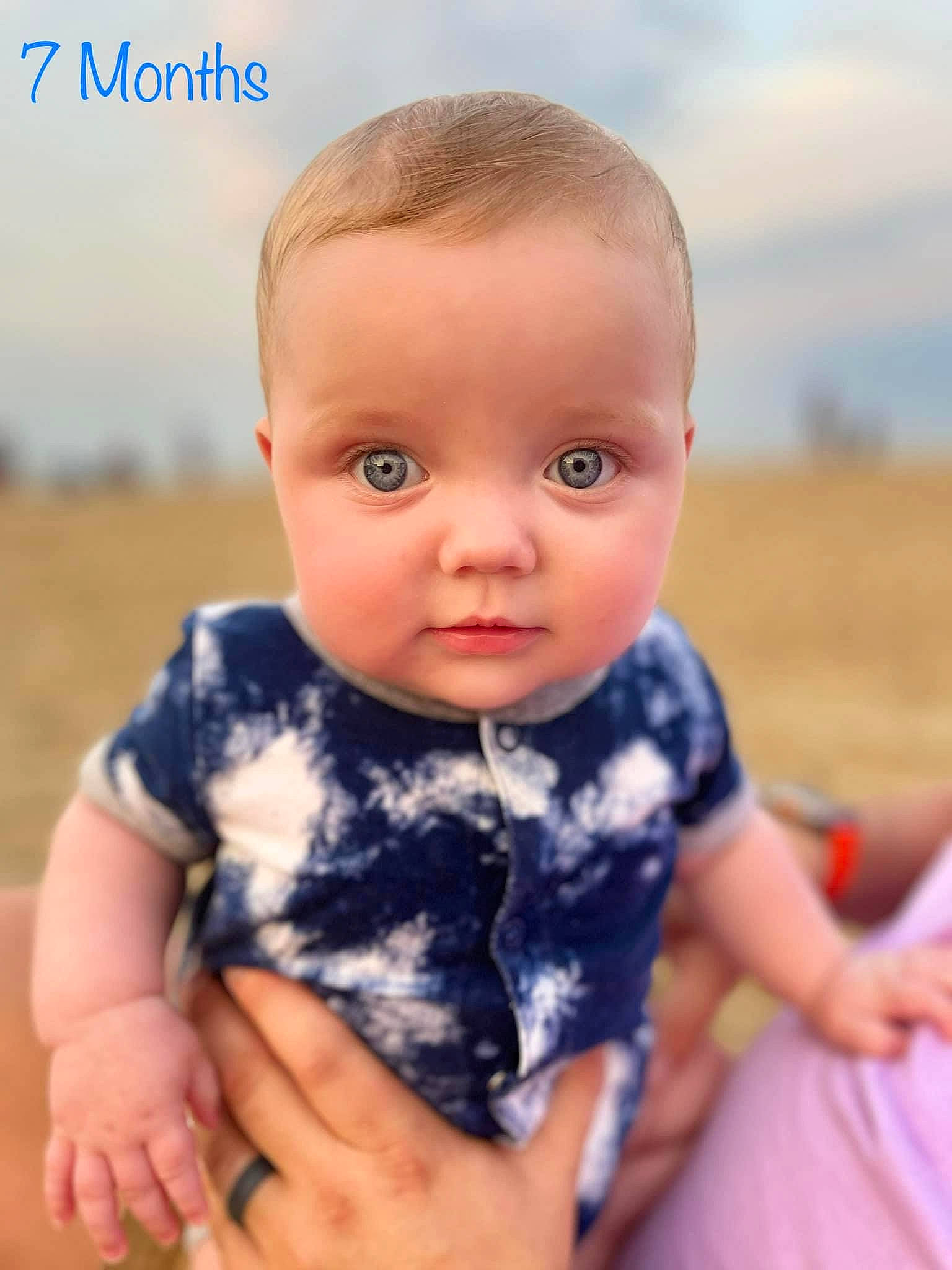 Nathaniel joined the competition — help win amazing prizes! baby, baby_toddler_clothing, cheek, child, chin, eye, finger, flash_photography, grass, hairstyle, happy, head, iris, people_in_nature, person, sitting, skin, sky, sleeve, thumb