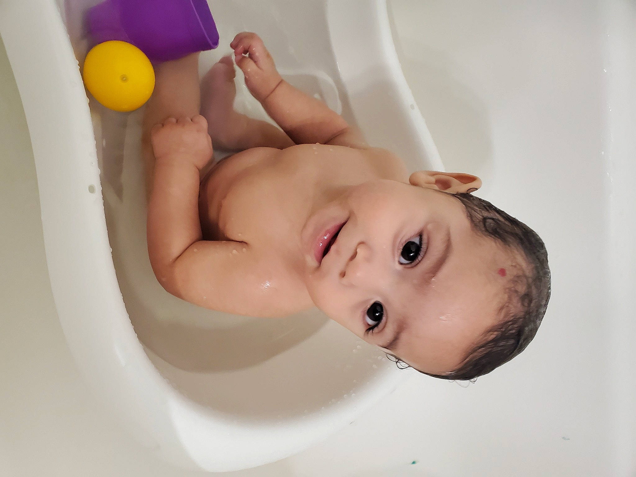 Josue joined the competition — help win amazing prizes! baby, baby_bathing, baby_playing_with_toys, baby_products, bathing, bathroom, bathtub, chest, child, eyelash, face, fluid, fun, happy, headgear, person, plumbing, plumbing_fixture, stomach, toddler