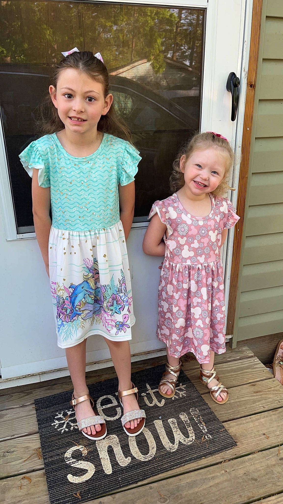 Chloe is registered to the contest to win money with this photo: baby_toddler_clothing, clothing, dress, facial_expression, fashion, footwear, hairstyle, happy, head, human_body, joy, leg, one_piece_garment, person, pink, shoe, skin, sleeve, smile, standing