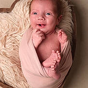 Juniper is registered to the contest to win money with this photo: newborn, baby, wrapped, blanket, heart_shaped_bowl, fluffy, cream_fabric, smiling, cute, infant, hands, feet, skin, face, portrait, soft_lighting, cozy, nestled, studio_photo, child