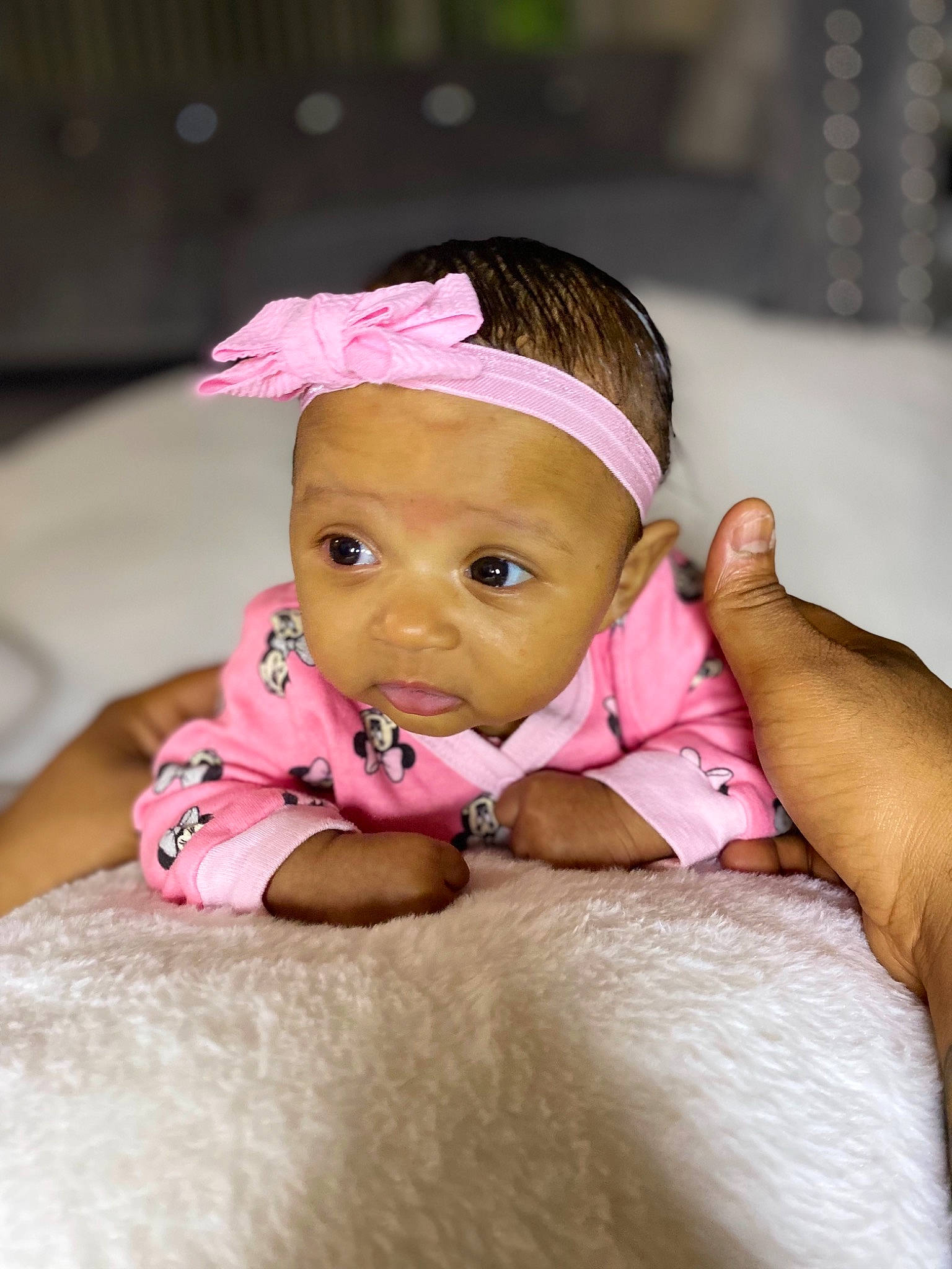 Melani is registered to the contest to win money with this photo: baby, baby_toddler_clothing, cheek, comfort, dress, eye, eyebrow, eyelash, finger, gesture, hand, happy, headgear, iris, lip, nose, person, pink, skin, thumb