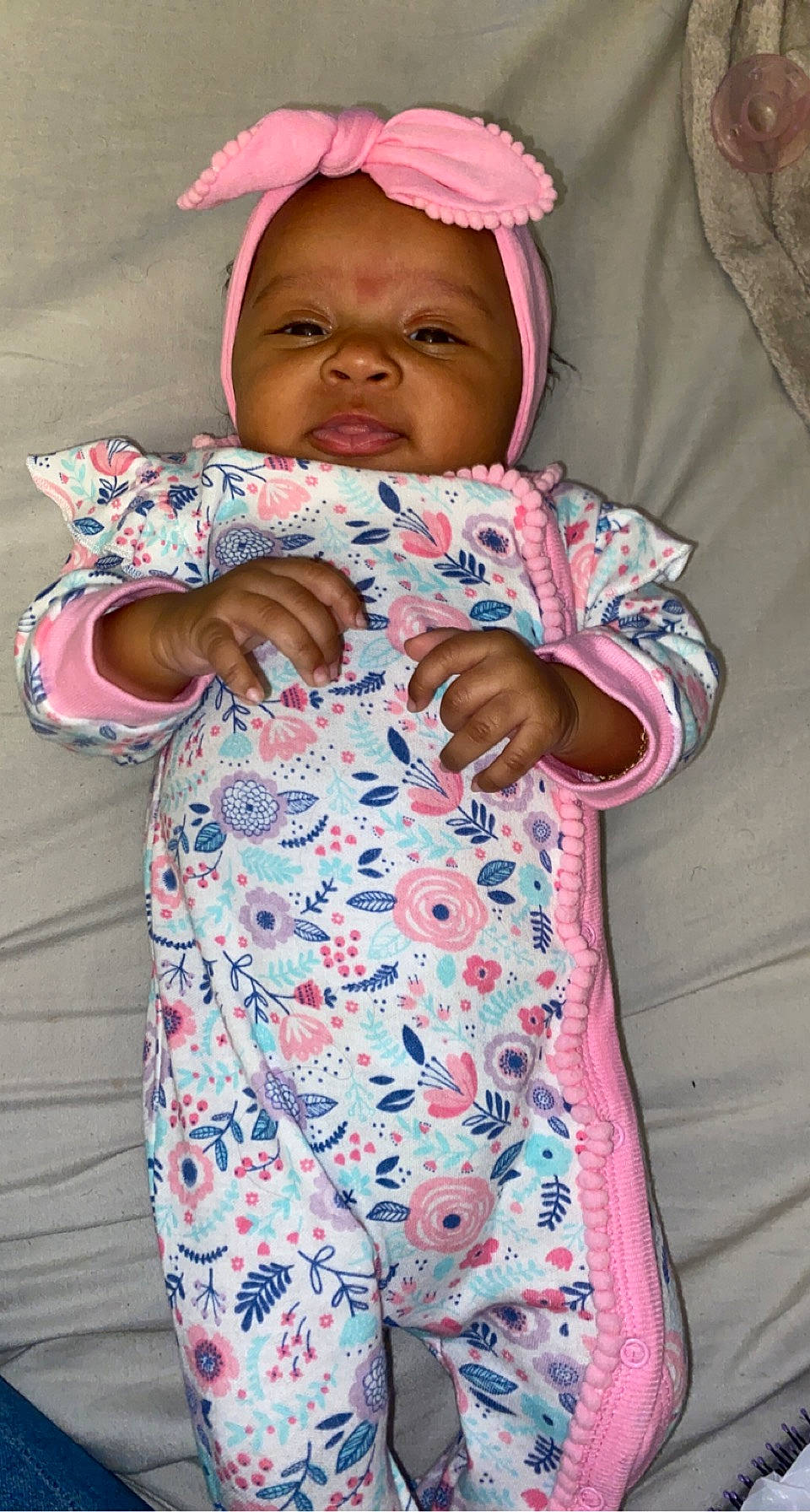 Melani is registered to the contest to win money with this photo: baby, baby_toddler_clothing, cap, cheek, face, facial_expression, finger, gesture, happy, head, headwear, nose, outerwear, person, pink, purple, skin, sleeve, smile, textile