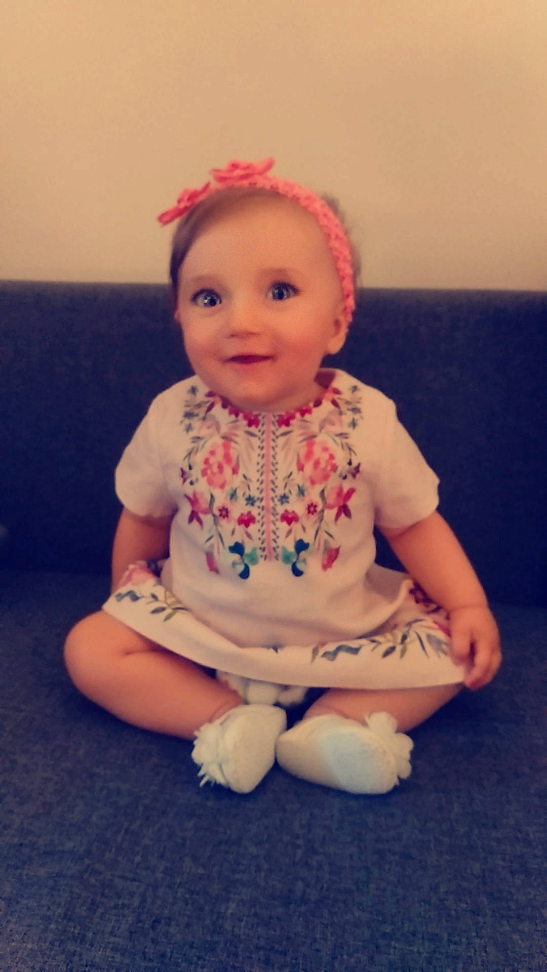Elyanna participe au concours pour gagner de l'argent avec cette photo : baby, baby_toddler_clothing, cheek, child, costume, doll, hair_accessory, head, headband, headgear, person, pink, sitting, skin, smile, toddler, toy