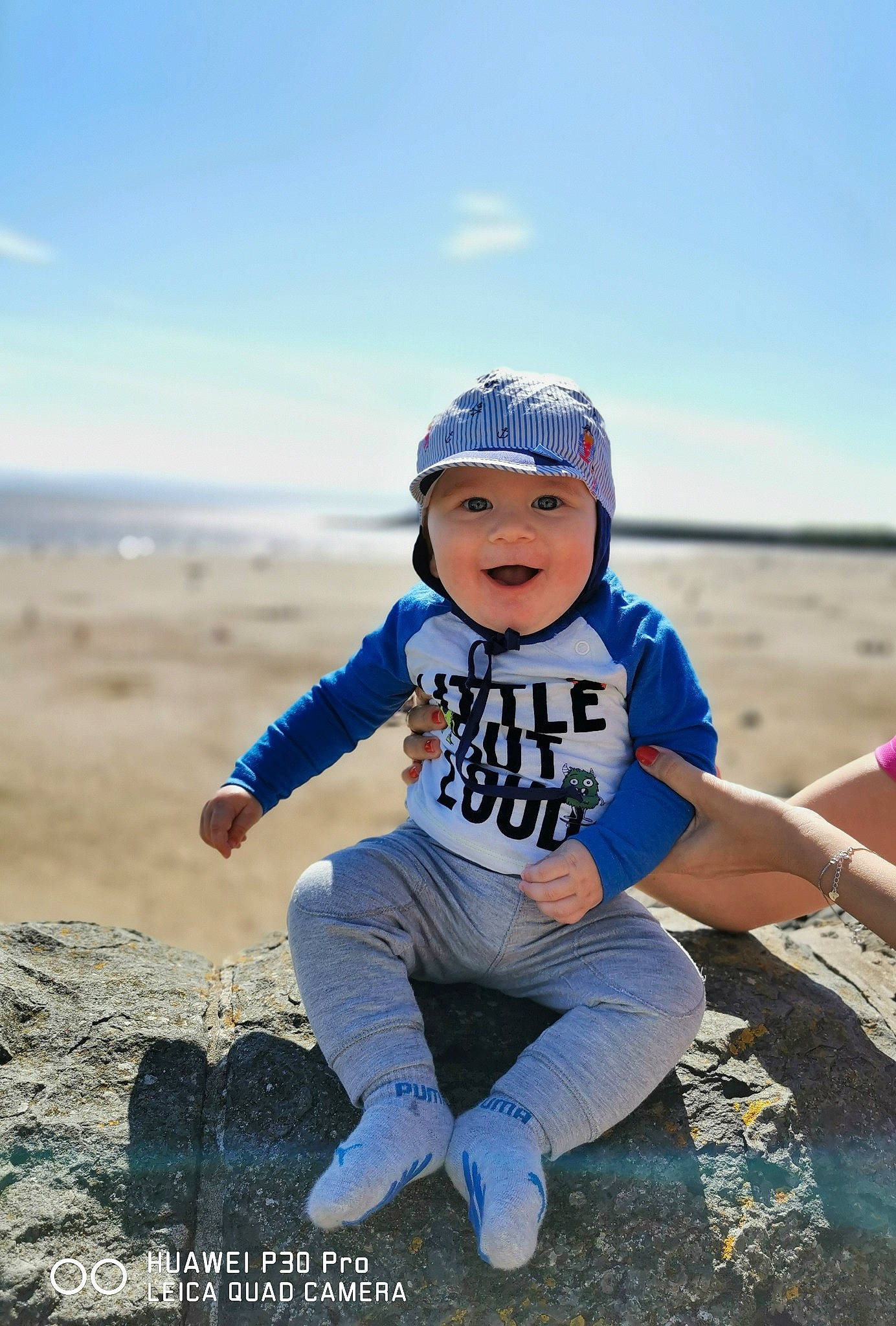 Matei is registered to the contest to win money with this photo: beach, child, cloud, coast, fun, happy, headwear, landscape, natural_environment, ocean, person, photo_shoot, photography, portrait_photography, recreation, sand, sea, sitting, sky, smile