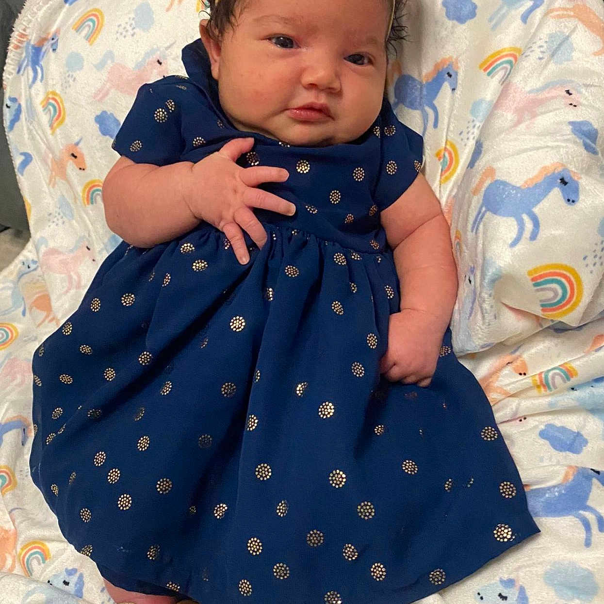 Isamary Sepulveda is registered to the contest to win money with this photo: baby, bed, blanket, childbirth, clothing, dress, face, footwear, furniture, hair, head, newborn, people, person, photography, portrait, quilt, sandal, sitting, sleeve