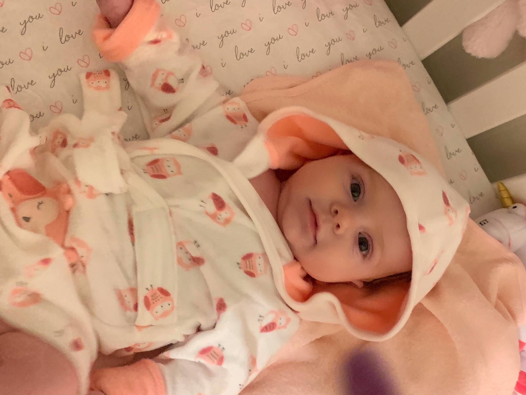 Journee is registered to the contest to win money with this photo: arm, baby, baby_toddler_clothing, bed, cheek, child, comfort, eyelash, finger, hand, head, headwear, human_body, linens, lip, mouth, nose, person, pink, product