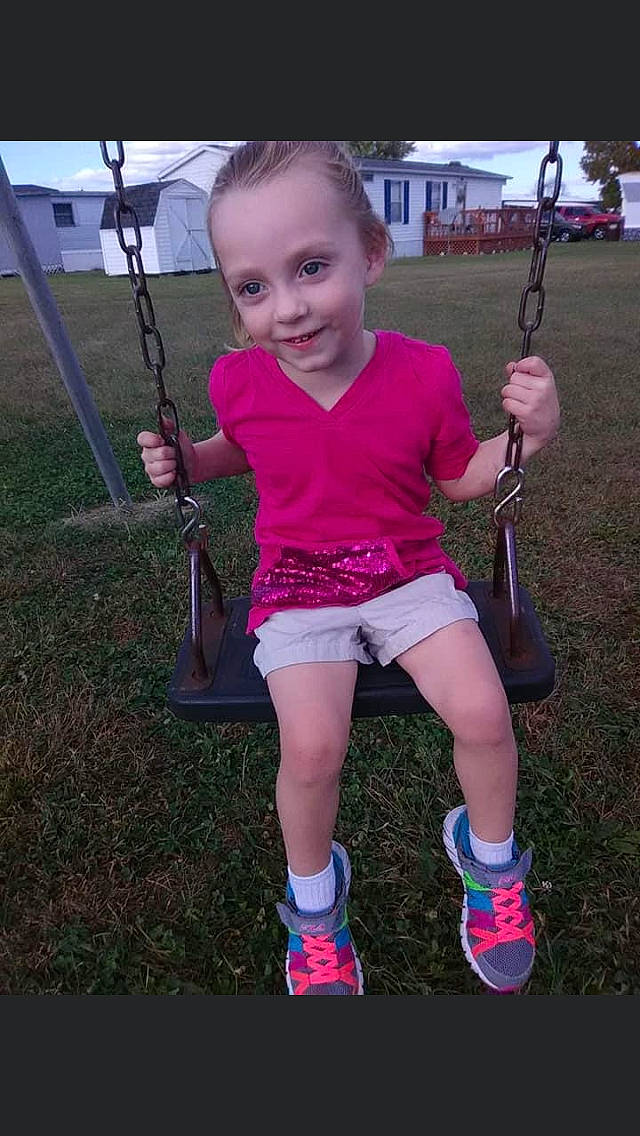 Talitha Elkins is registered to the contest to win money with this photo: child, fun, joy, magenta, outdoor_play_equipment, person, pink, play, playground, smile, swing, toddler