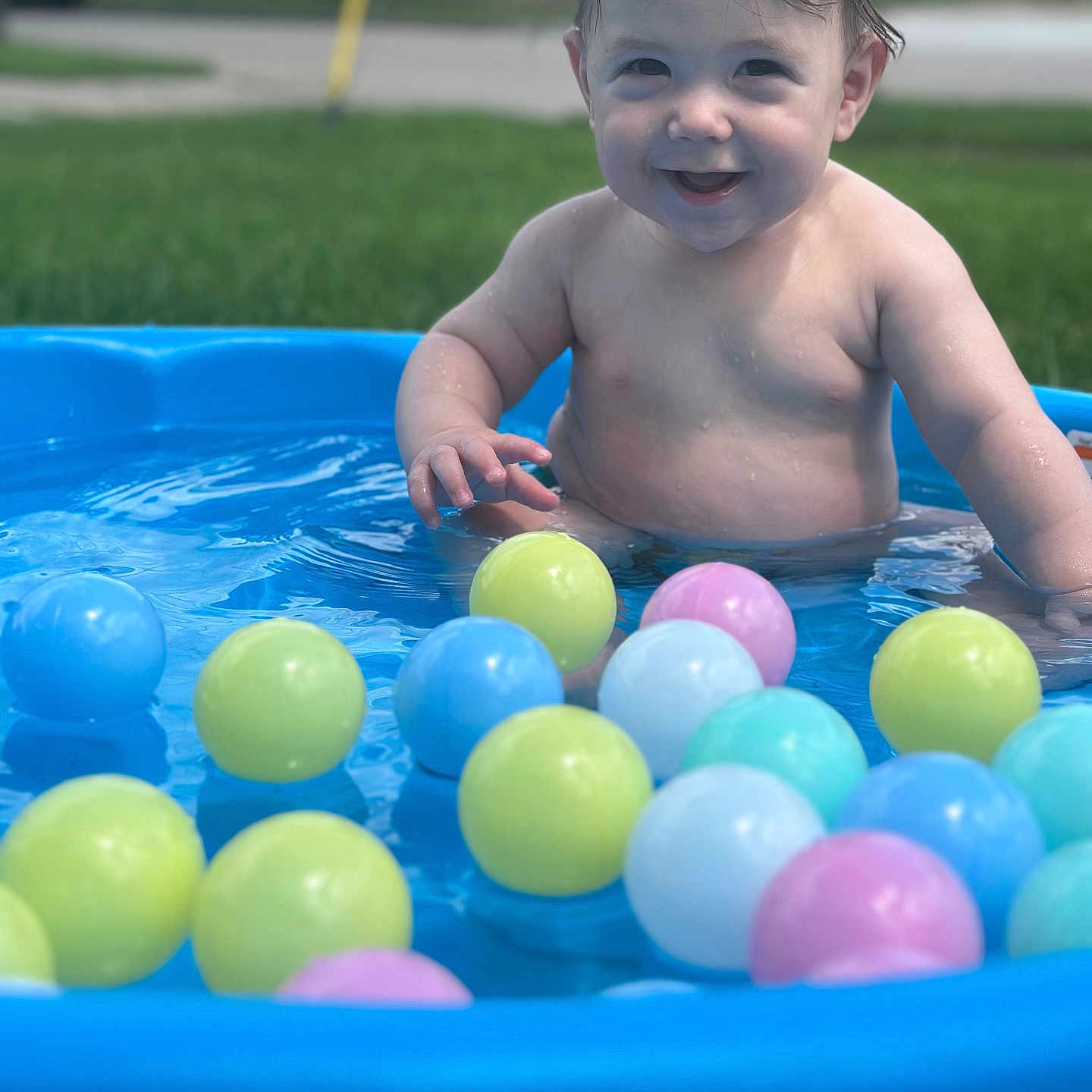 Emiliano is registered to the contest to win money with this photo: baby, backyard, face, grass, head, leisureactivities, nature, outdoors, person, photography, plant, pool, portrait, sport, summer, swimming, swimmingpool, water, watersports, yard