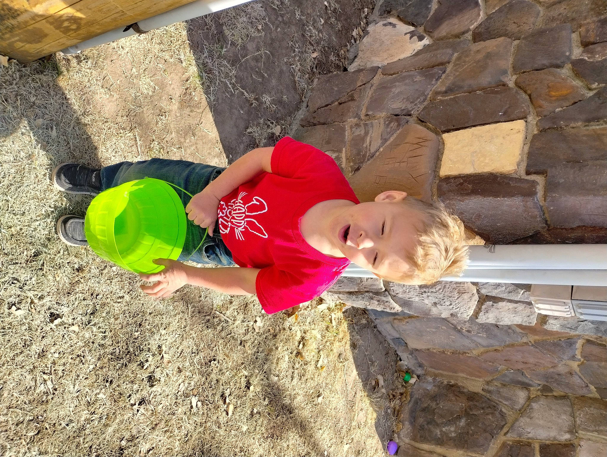 Ransom is registered to the contest to win money with this photo: brick, child, concrete, fun, grass, happy, hat, landscape, leisure, outdoor_play_equipment, people_in_nature, person, play, recreation, sandal, soil, t_shirt, thigh, toddler, tree