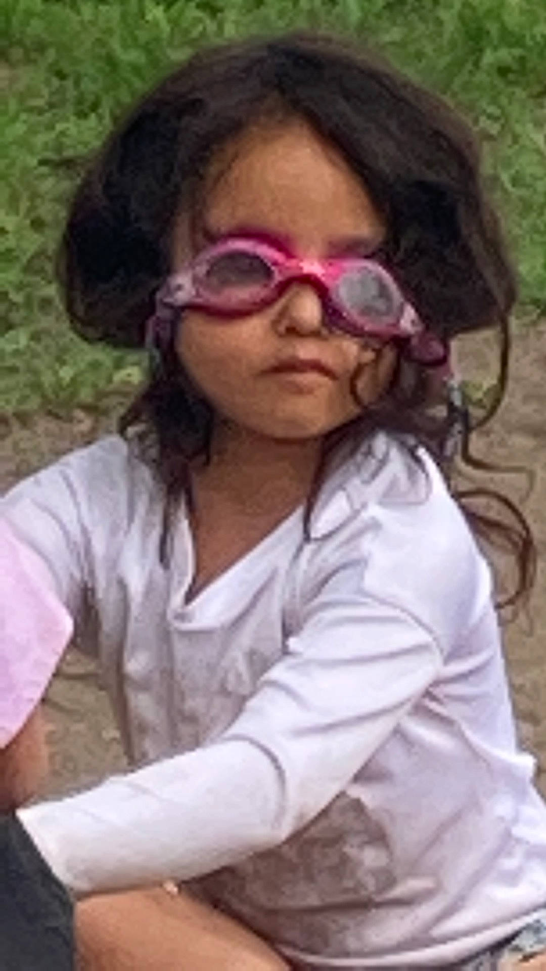 Leanne Rae is registered to the contest to win money with this photo: audio_equipment, black_hair, clothing, eyebrow, eyelash, eyewear, forehead, goggles, grass, hair, happy, head, lip, mouth, neck, nose, outerwear, person, sleeve, sunglasses