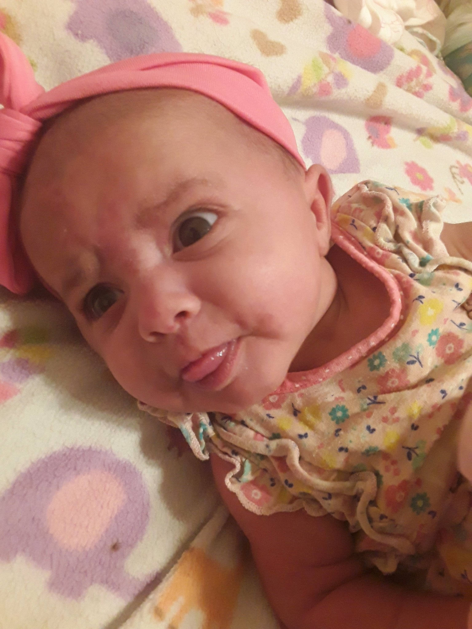 Lalla is registered to the contest to win money with this photo: baby, cheek, child, ear, face, head, headgear, lip, mouth, nose, person, pink, skin, smile, toddler