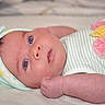 Alisson is registered to the contest to win money with this photo: baby, infant, child, portrait, lying_down, wide_eyes, smiling, face, chubby, bow_hat, striped_clothing, mint_green, blanket, bed, indoors, close_up, baby_clothing, pastel_colors, relaxed, photography