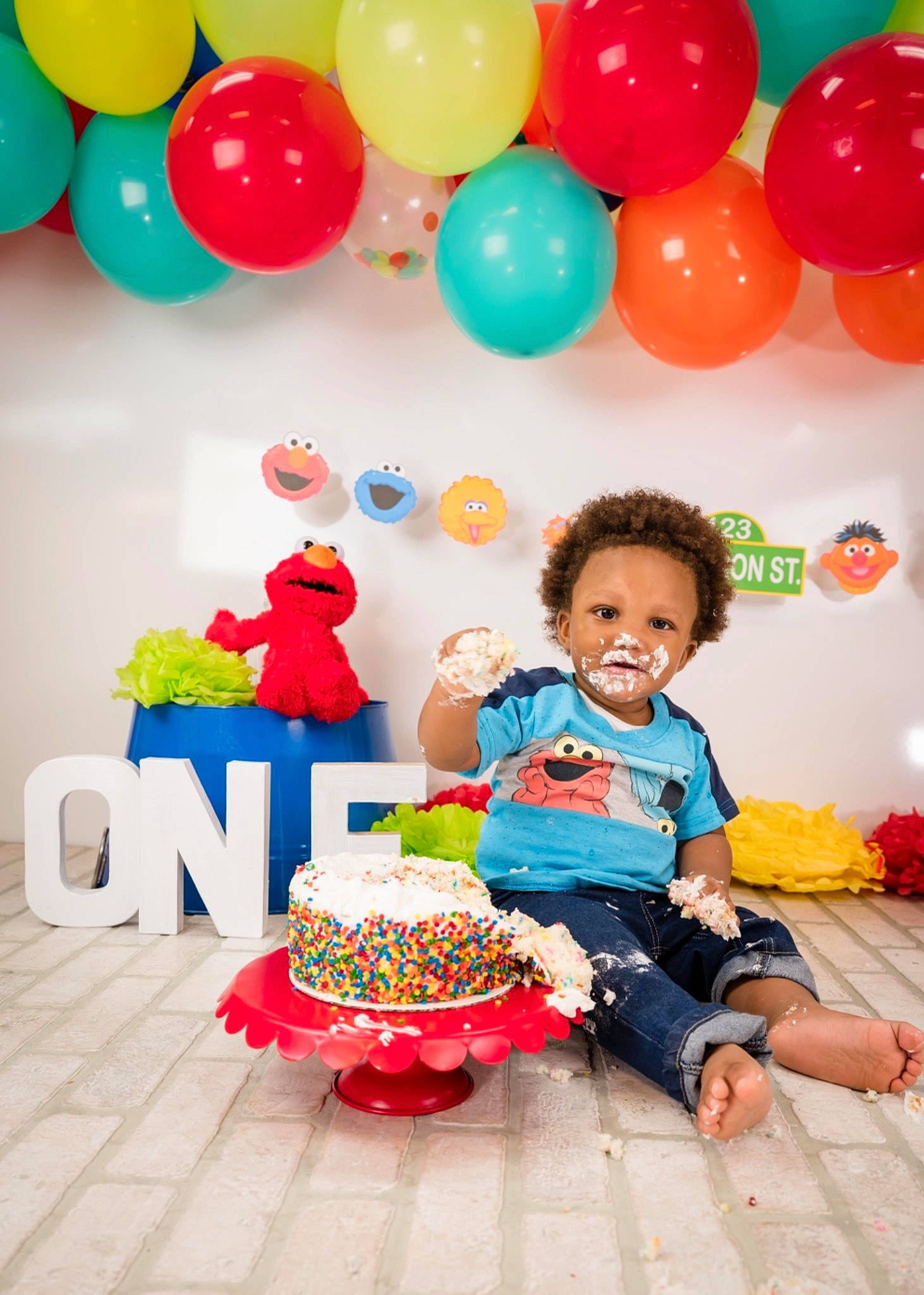 Kameron is registered to the contest to win money with this photo: baby_toddler_clothing, balloon, birthday, birthday_party, chair, child, event, fun, happy, leisure, orange, party_supply, person, pink, red, smile, sweetness, t_shirt, toddler, white