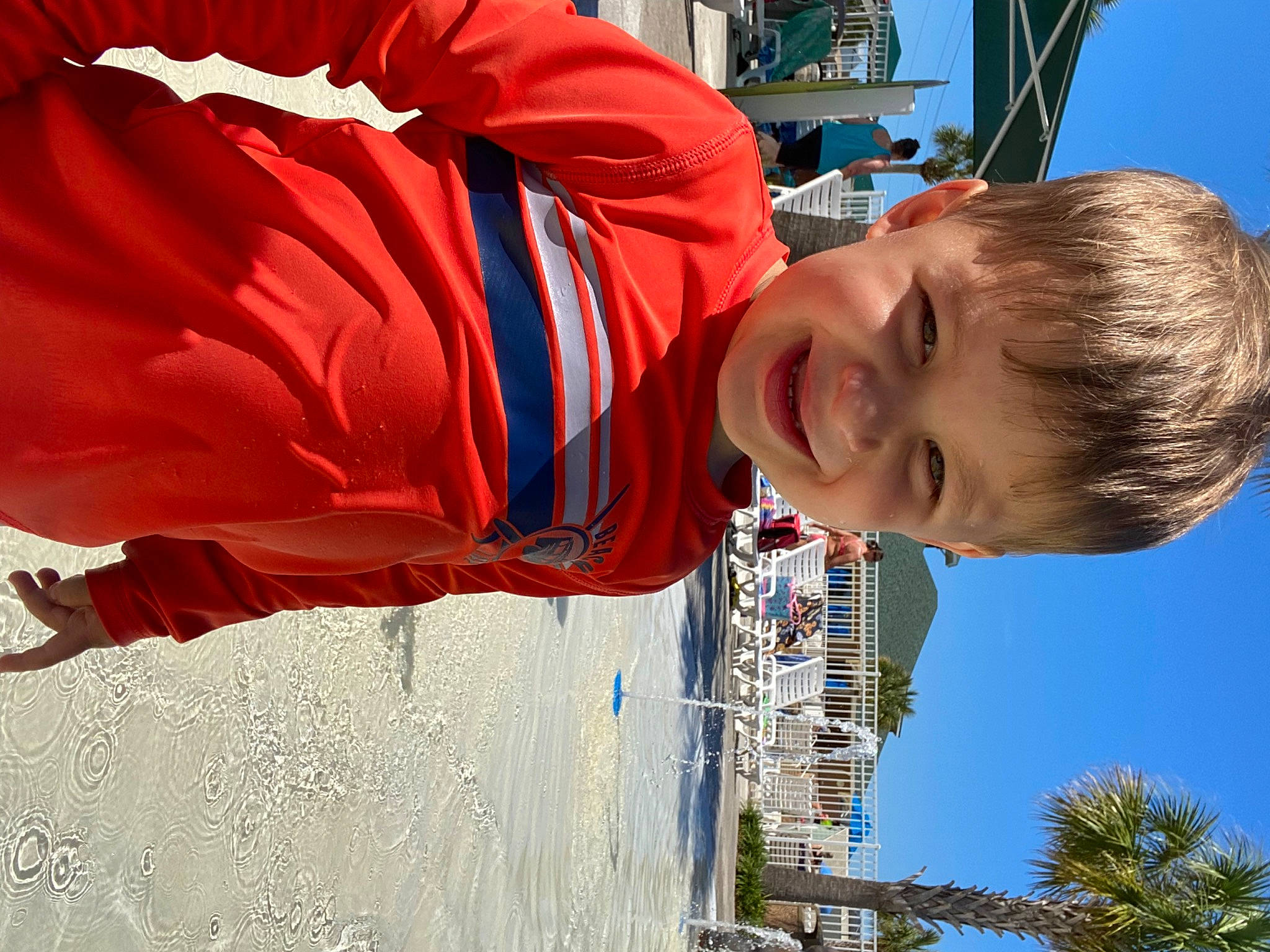 Clayton is registered to the contest to win money with this photo: blue, building, carmine, child, chin, coquelicot, electric_blue, fun, happy, joy, leisure, person, sky, smile, t_shirt, toddler, tourism, travel, tree, vacation