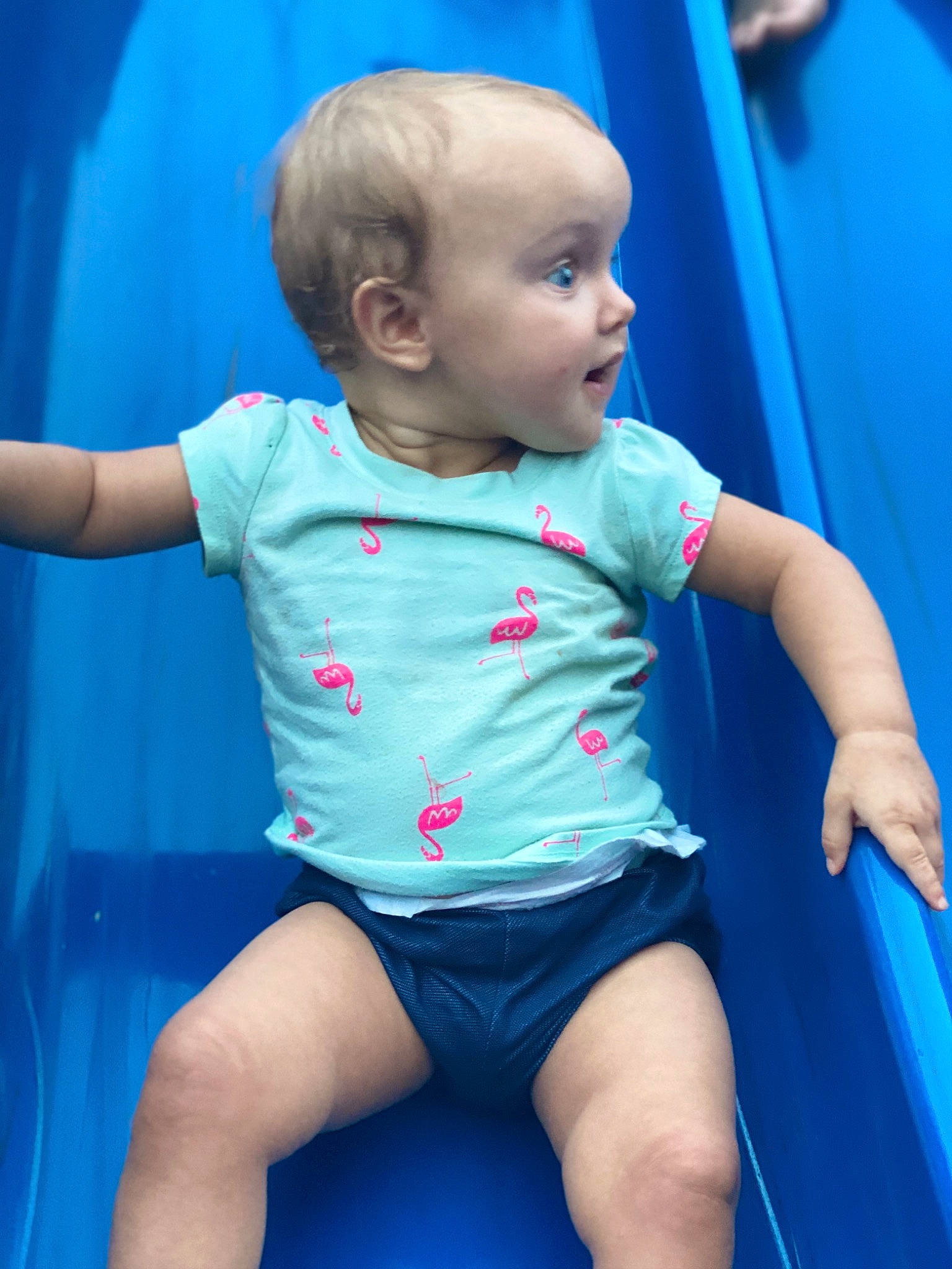 Alivia is registered to the contest to win money with this photo: baby, baby_products, blue, cheek, child, eye, fun, games, leg, leisure, person, play, product, recreation, sitting, skin, smile, surprise, toddler, vacation